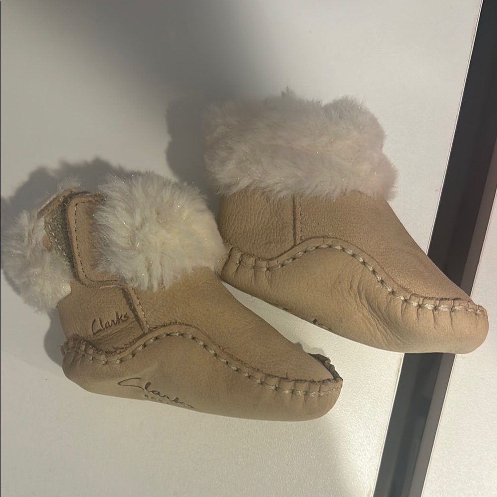 like new! Clarks Beige Baby Moccasins with Fluffy Trim, size 0-3 month